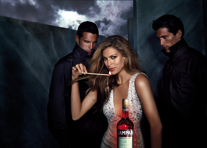 Woman with Campari bottle and men