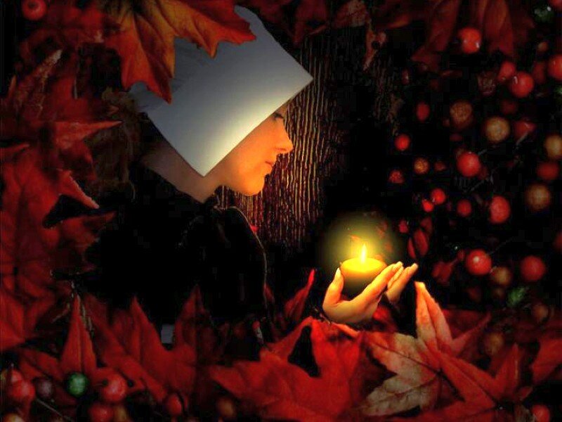 woman with candle in autumn