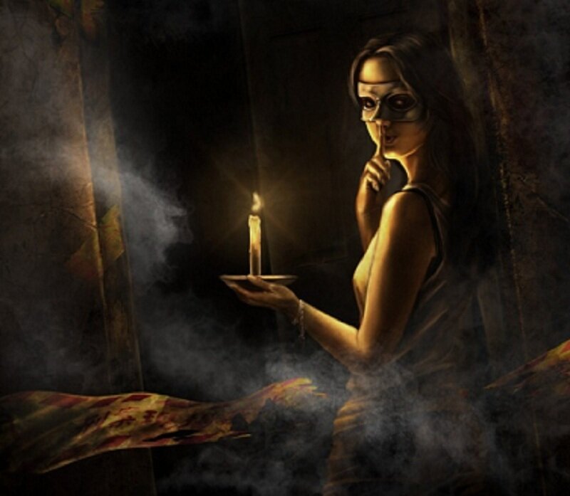 Woman with candle in dark room