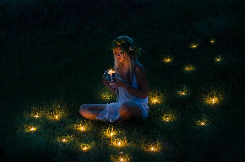 Woman with Candle in Grass