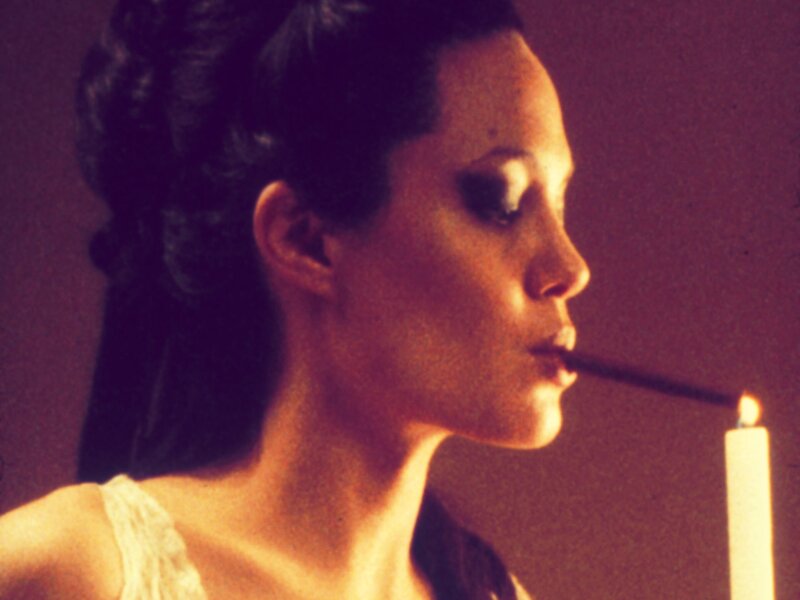 woman with candle in profile