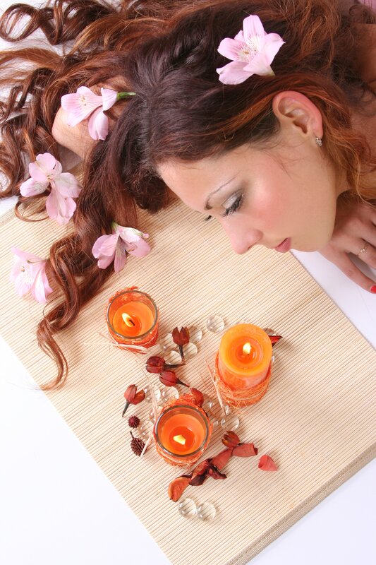 woman with candles and flowers