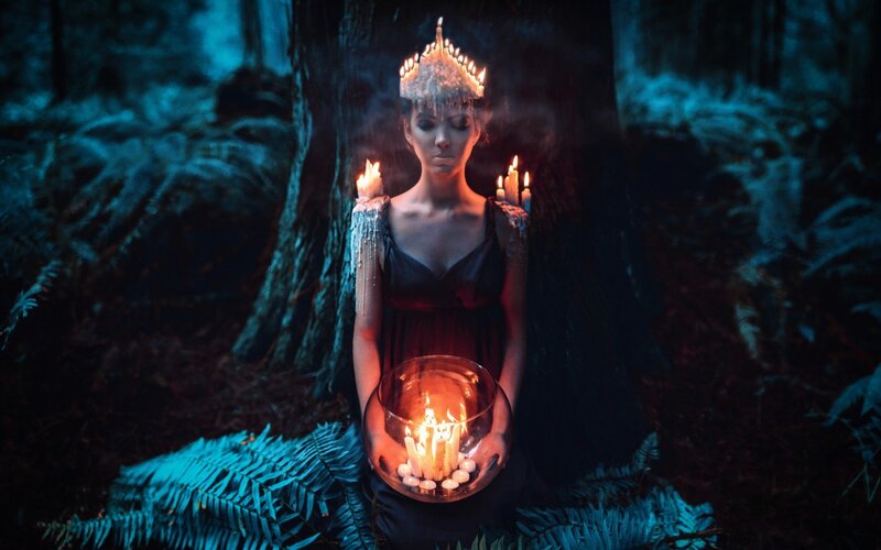 Woman with Candles in Forest