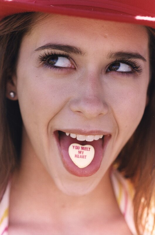 woman with candy in mouth