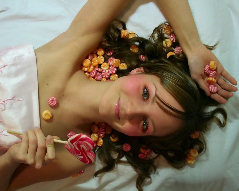 woman with candy on bed