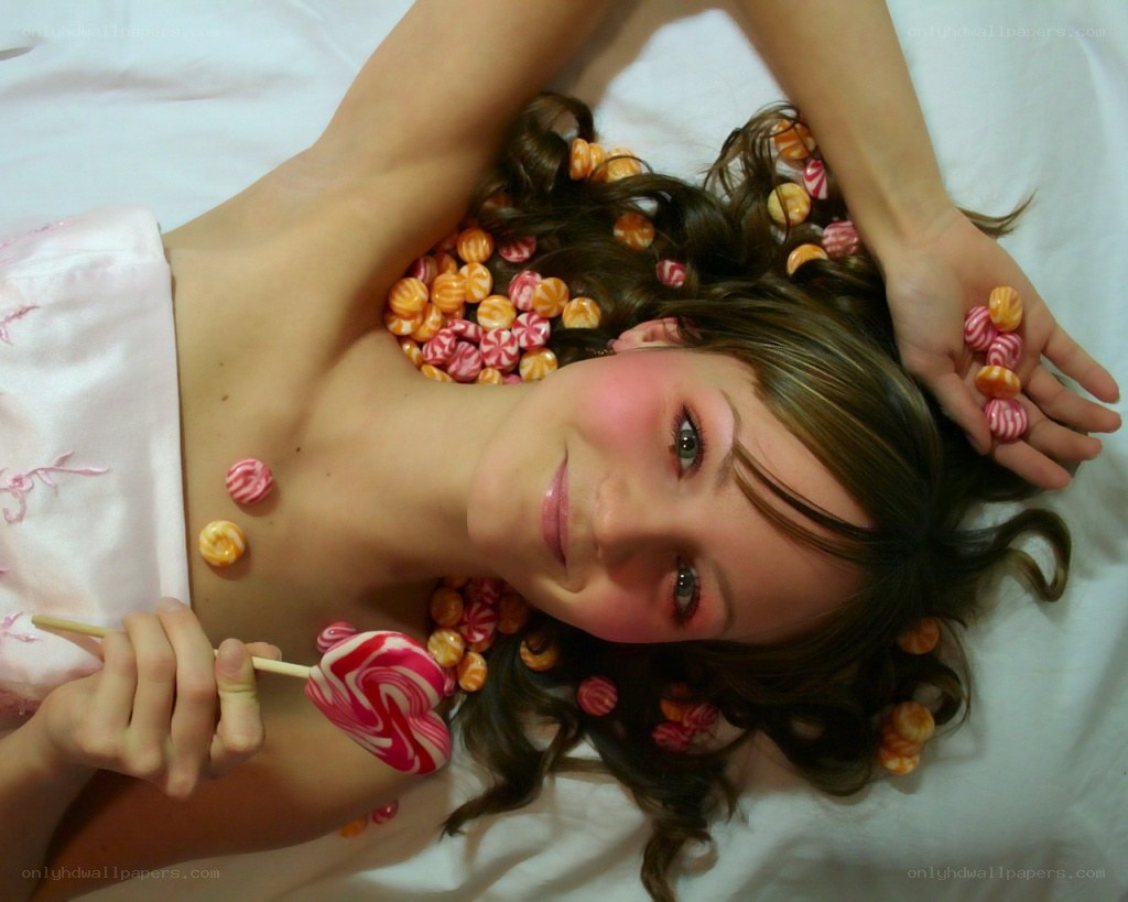 woman with candy on bed