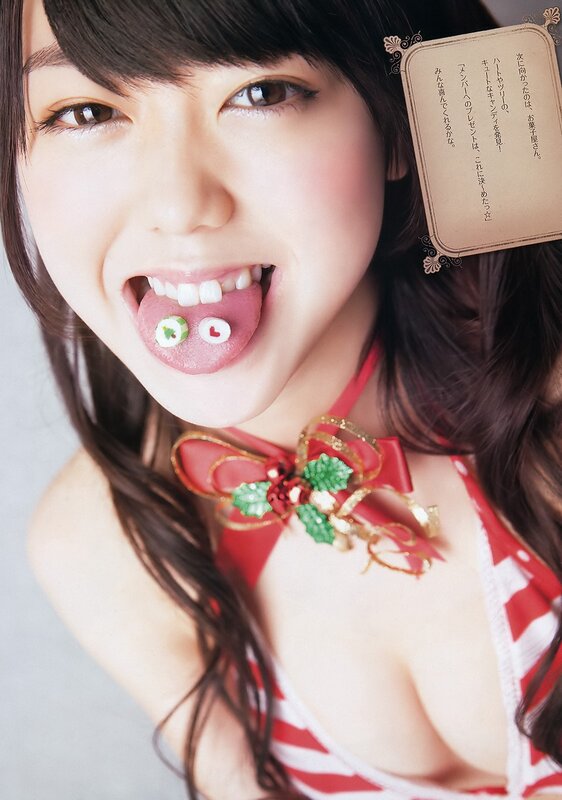 woman with candy on tongue