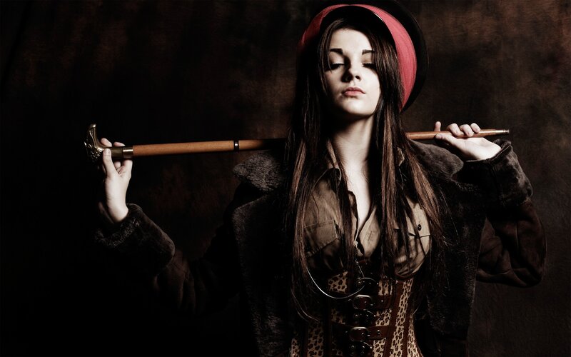 woman with cane and hat