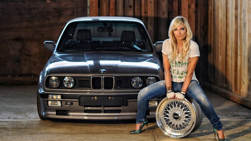woman with car and wheel