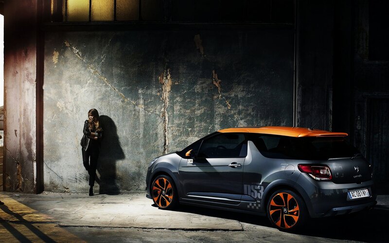 Woman with car in warehouse