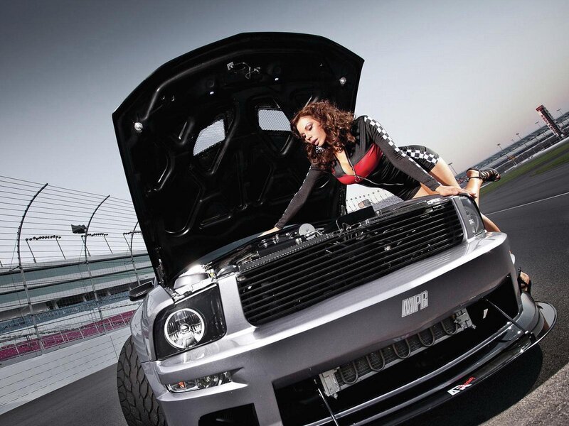 woman with car on racetrack