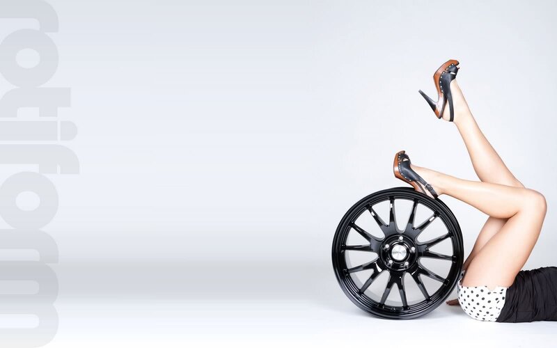 woman with car wheel