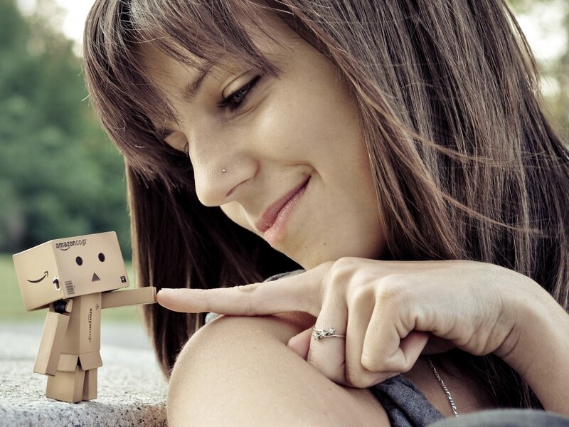 woman with cardboard robot
