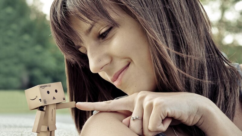 woman with cardboard robot