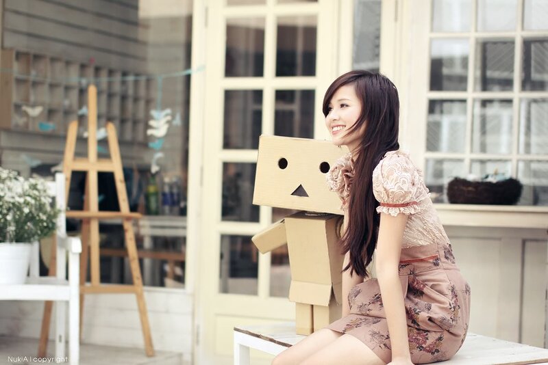 Woman with Cardboard Robot — Beige