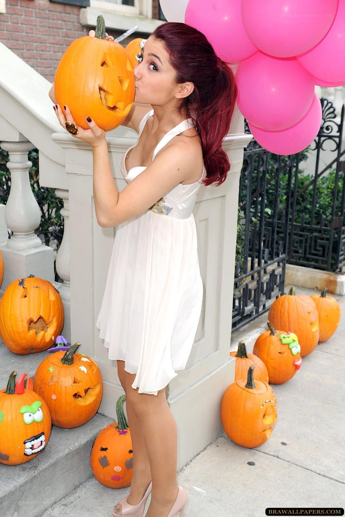 woman with carved pumpkins