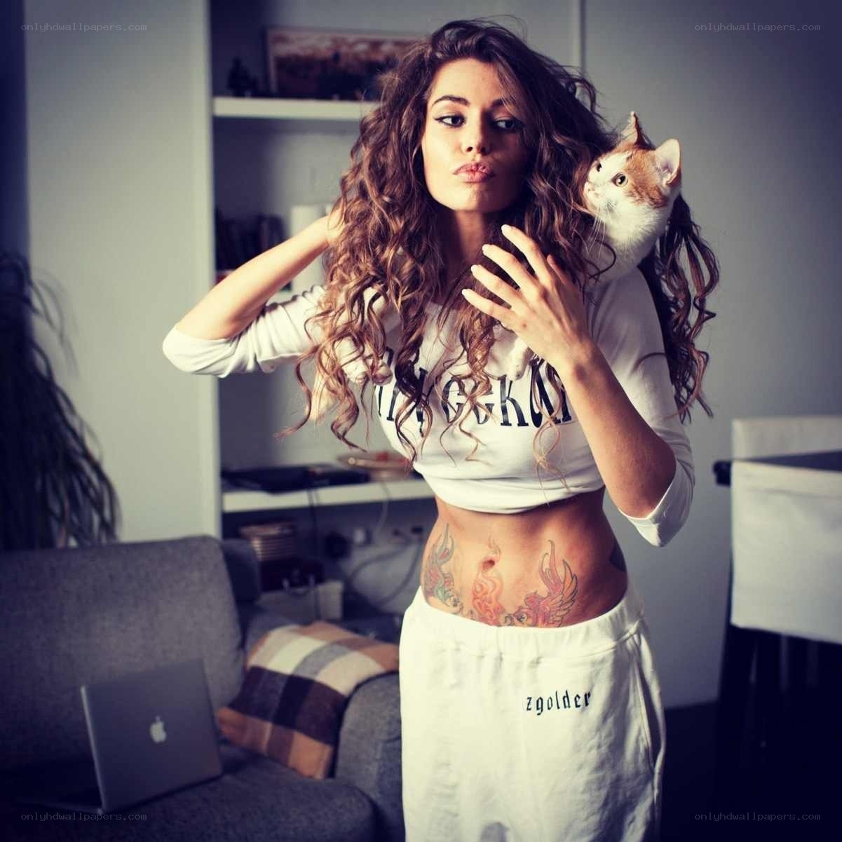 Woman with cat and tattoos
