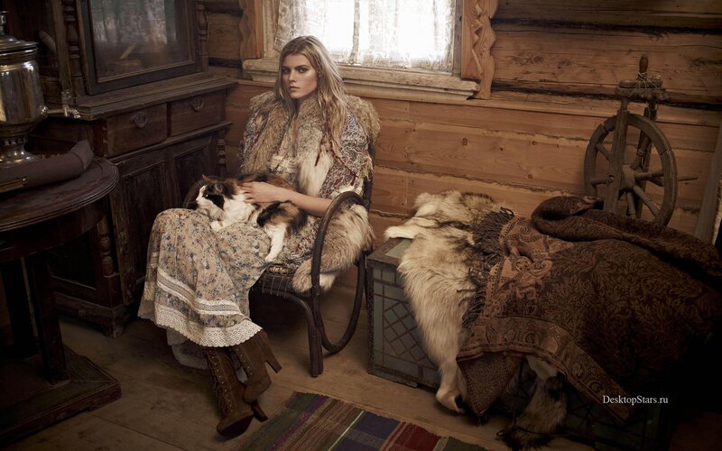 Woman with cat in rustic cabin