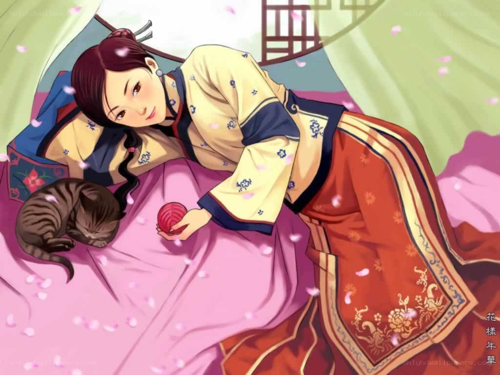 woman with cat on bed
