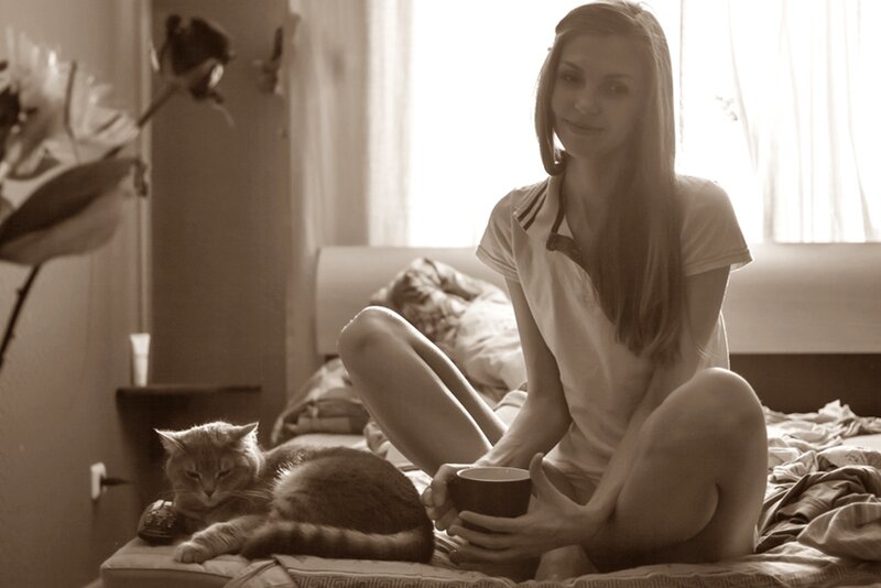 Woman with Cat on Bed — Sepia
