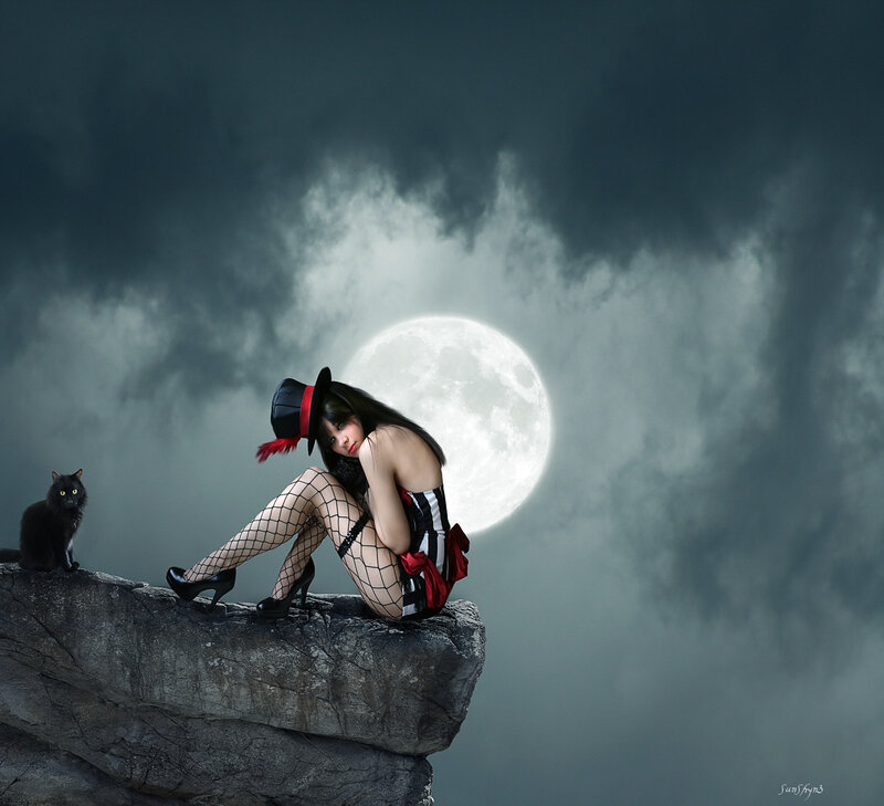 Woman with cat on cliff