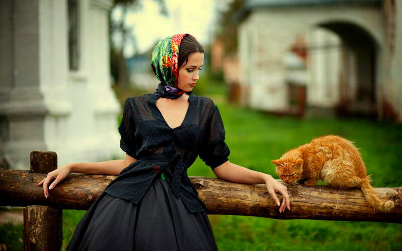 Woman with Cat on Fence