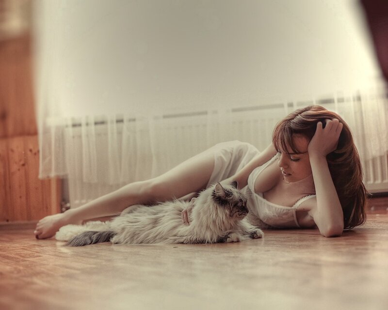 Woman with cat on floor