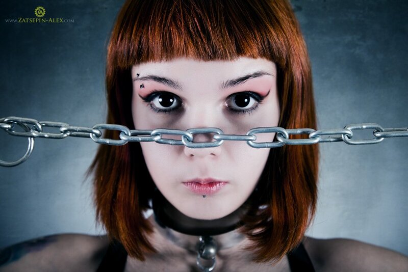 woman with chain across face