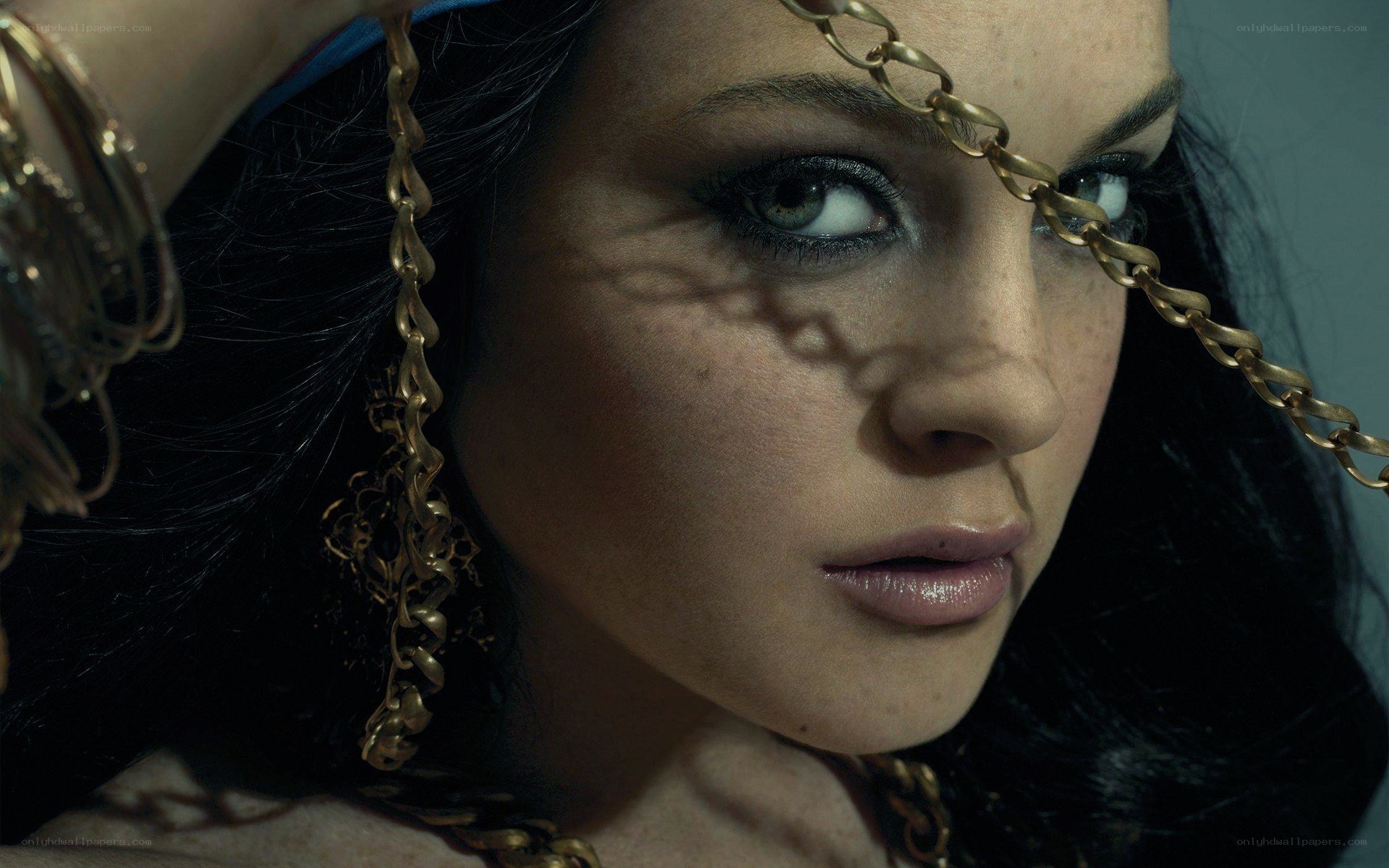 woman with chain over face
