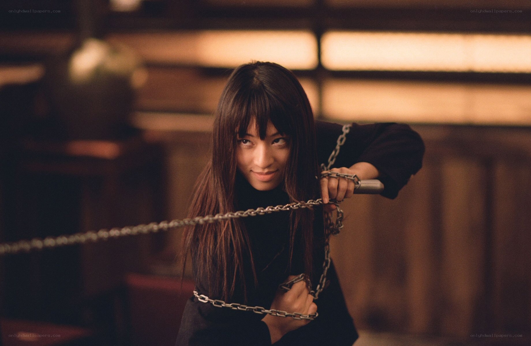 Woman with chain weapon