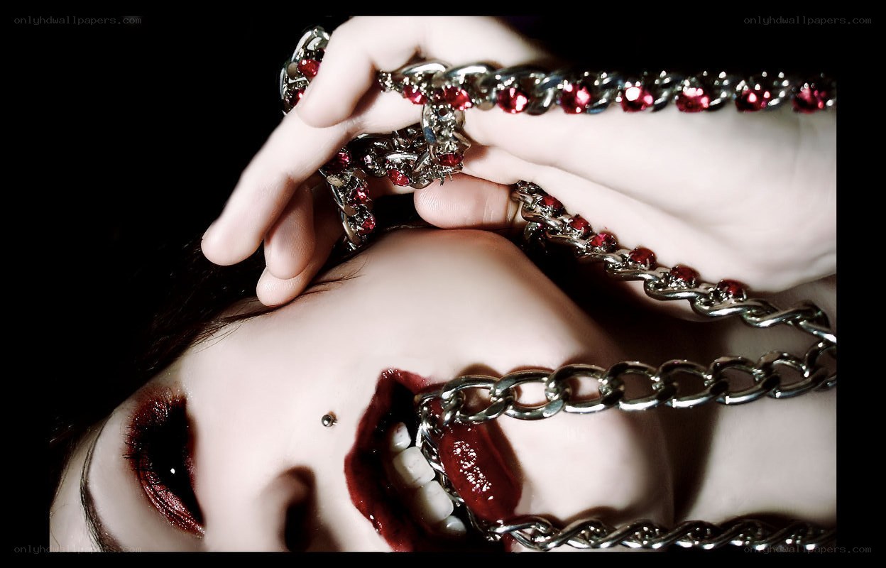 woman with chains and red makeup