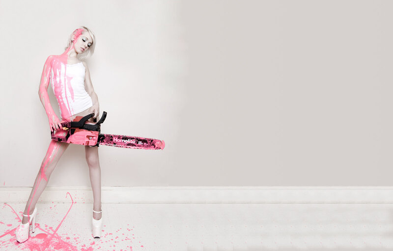 woman with chainsaw and pink paint
