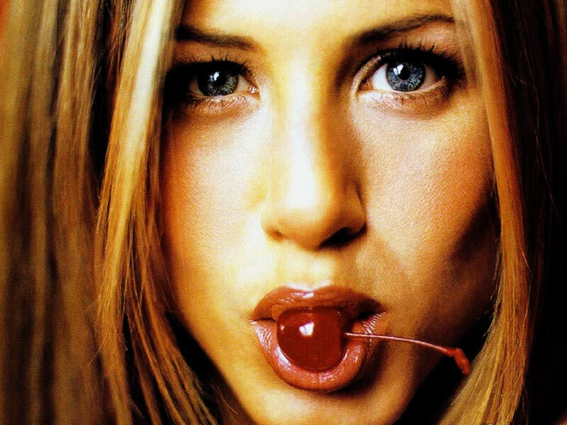 woman with cherry in mouth
