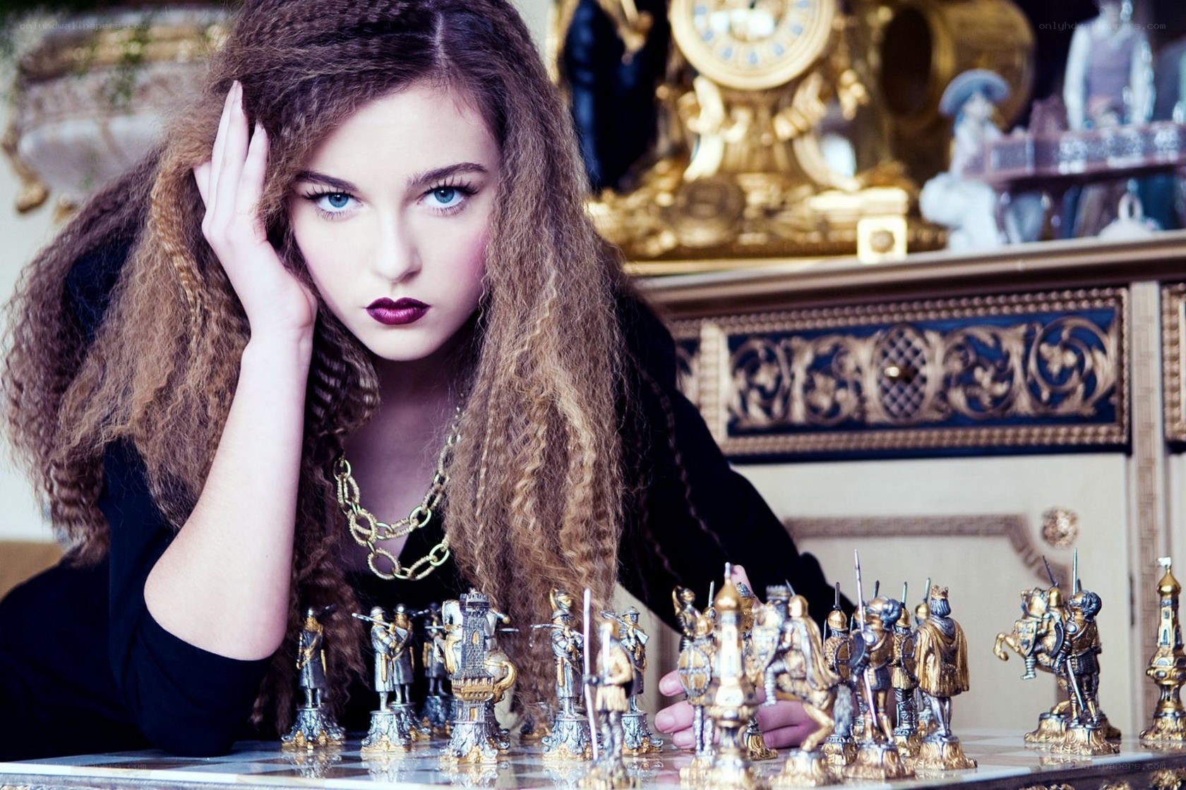 woman with chess pieces