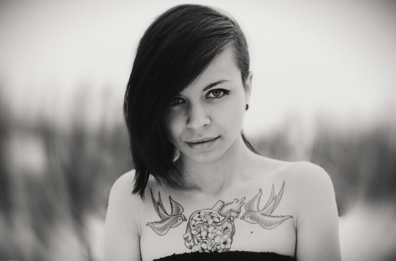 woman with chest tattoo