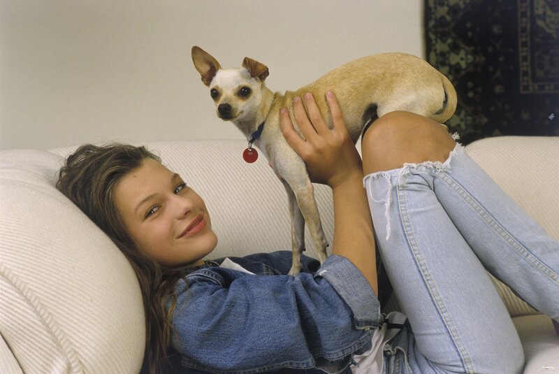 Woman with chihuahua on couch