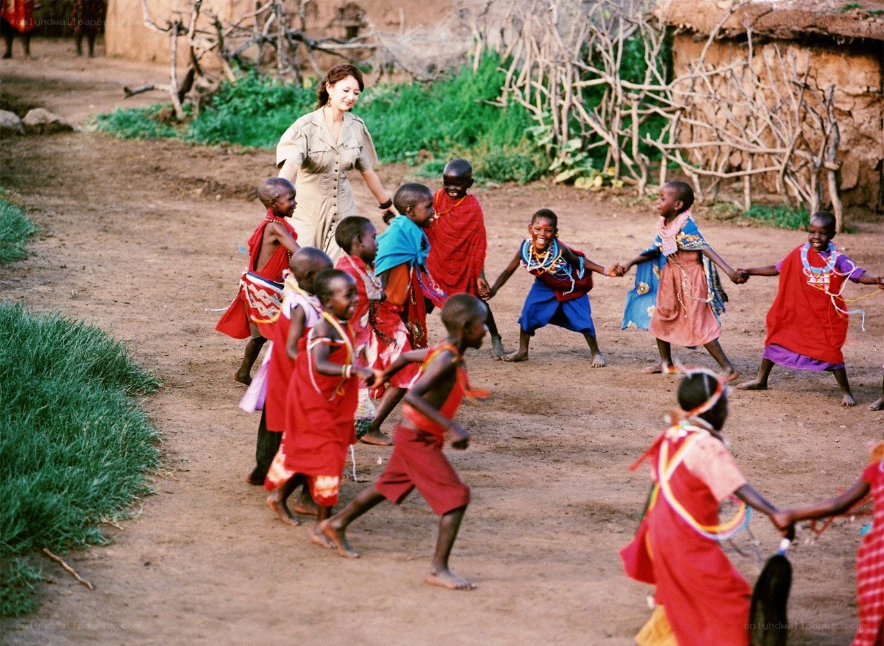 woman with children dancing