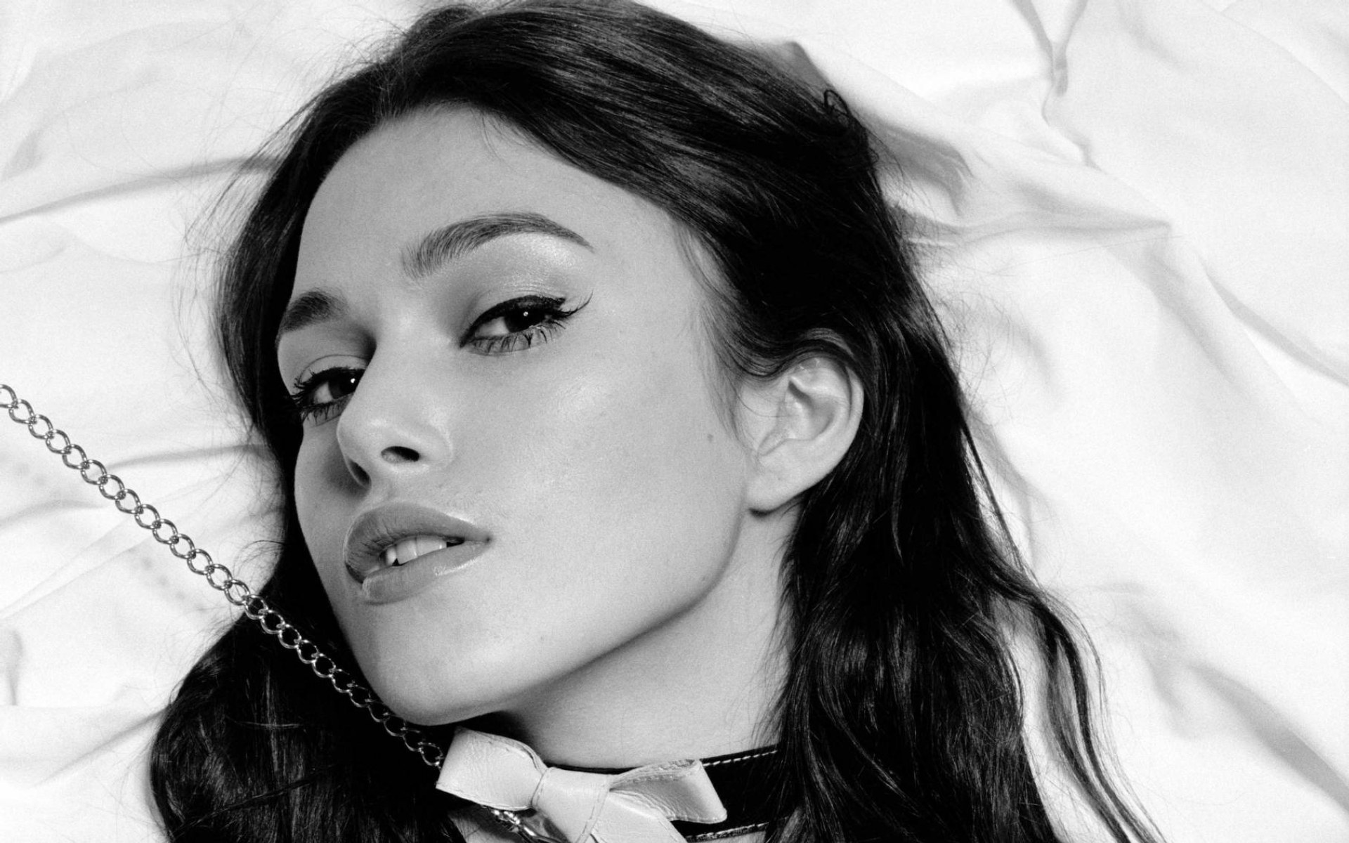 woman with choker lying down