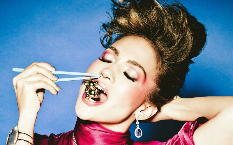 woman with chopsticks and gold earring