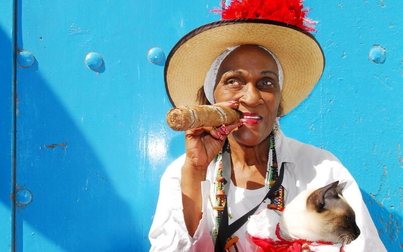 Woman with cigar and cat