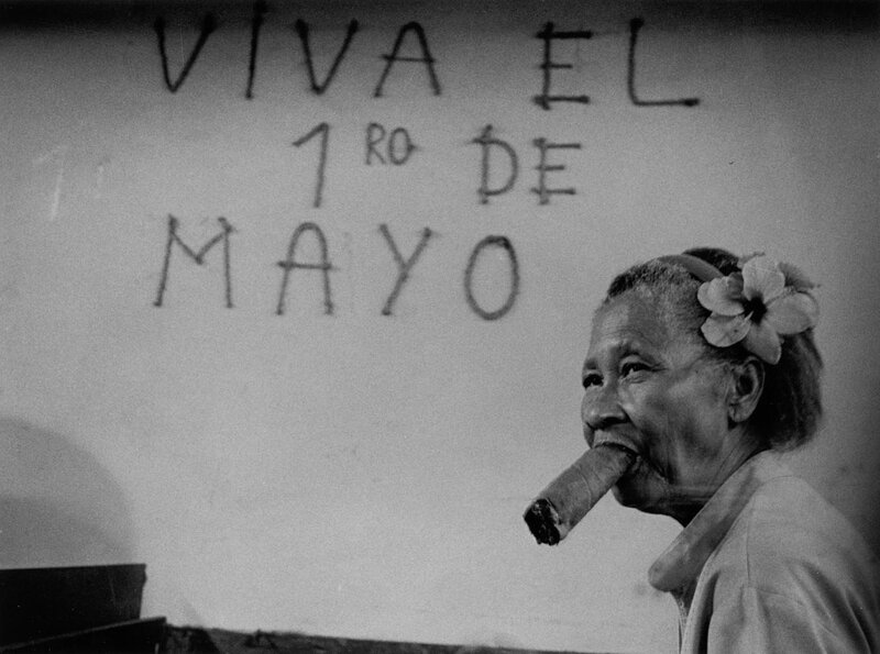 Woman with cigar and May Day sign