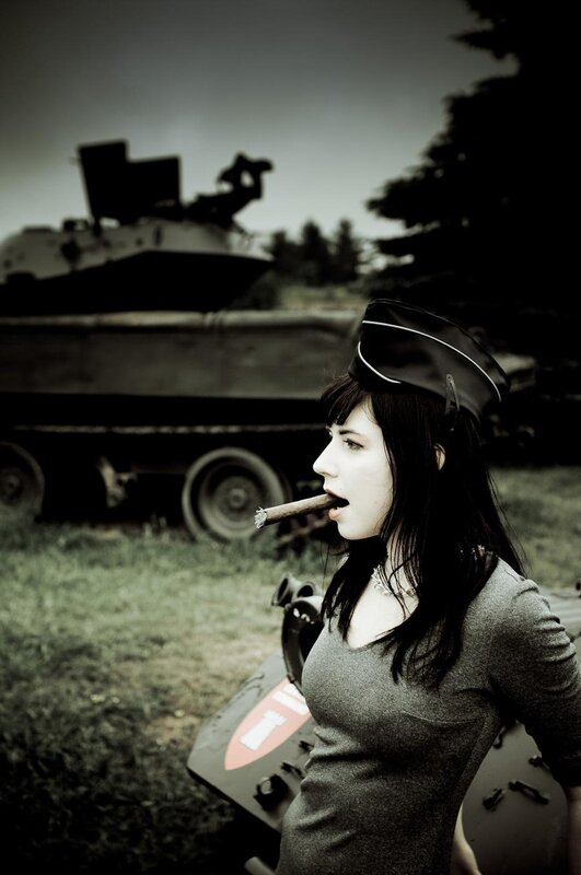 woman with cigar near tank