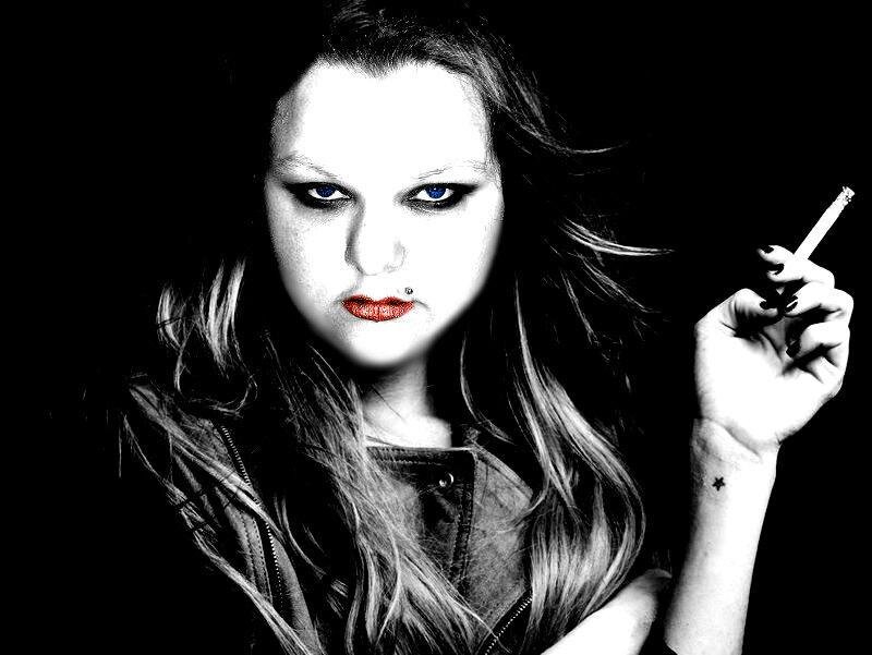 woman with cigarette and dark makeup