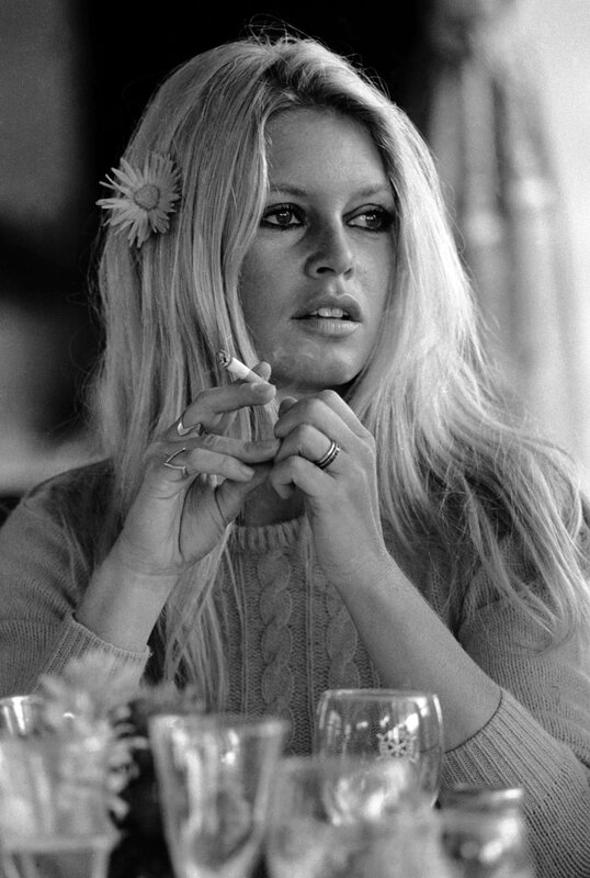 Woman with cigarette and flower