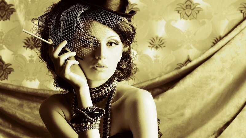 woman with cigarette and hat