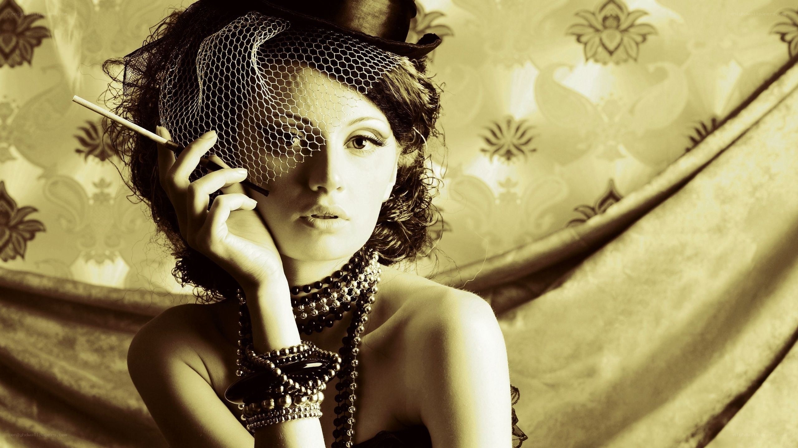 woman with cigarette and hat