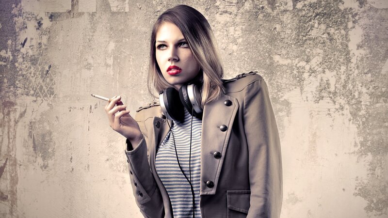 woman with cigarette and headphones