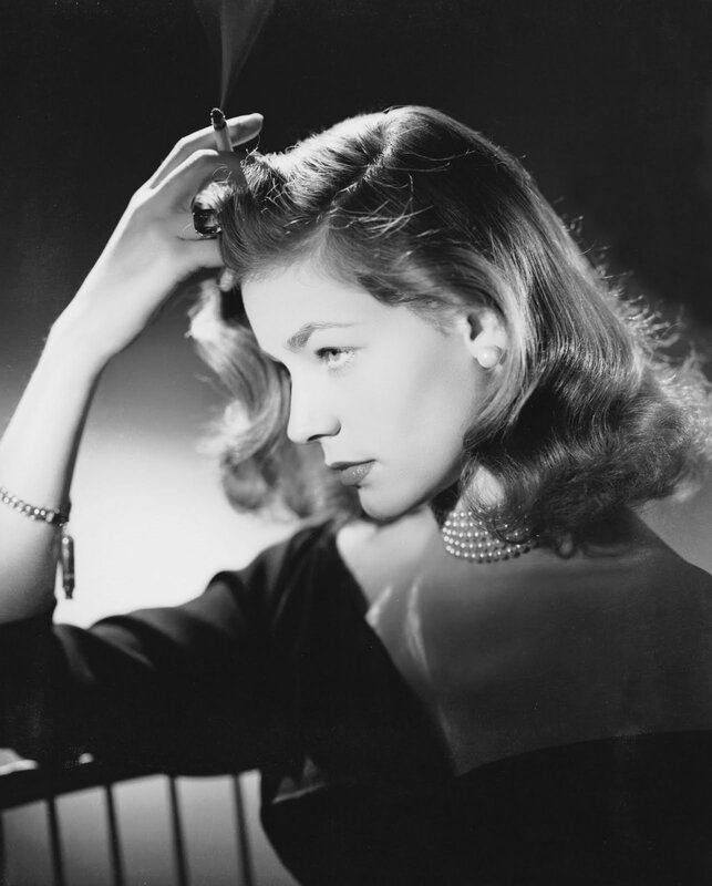 woman with cigarette and pearls