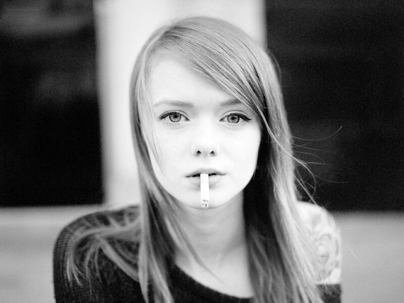 woman with cigarette in mouth