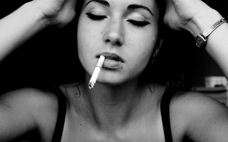 woman with cigarette in mouth